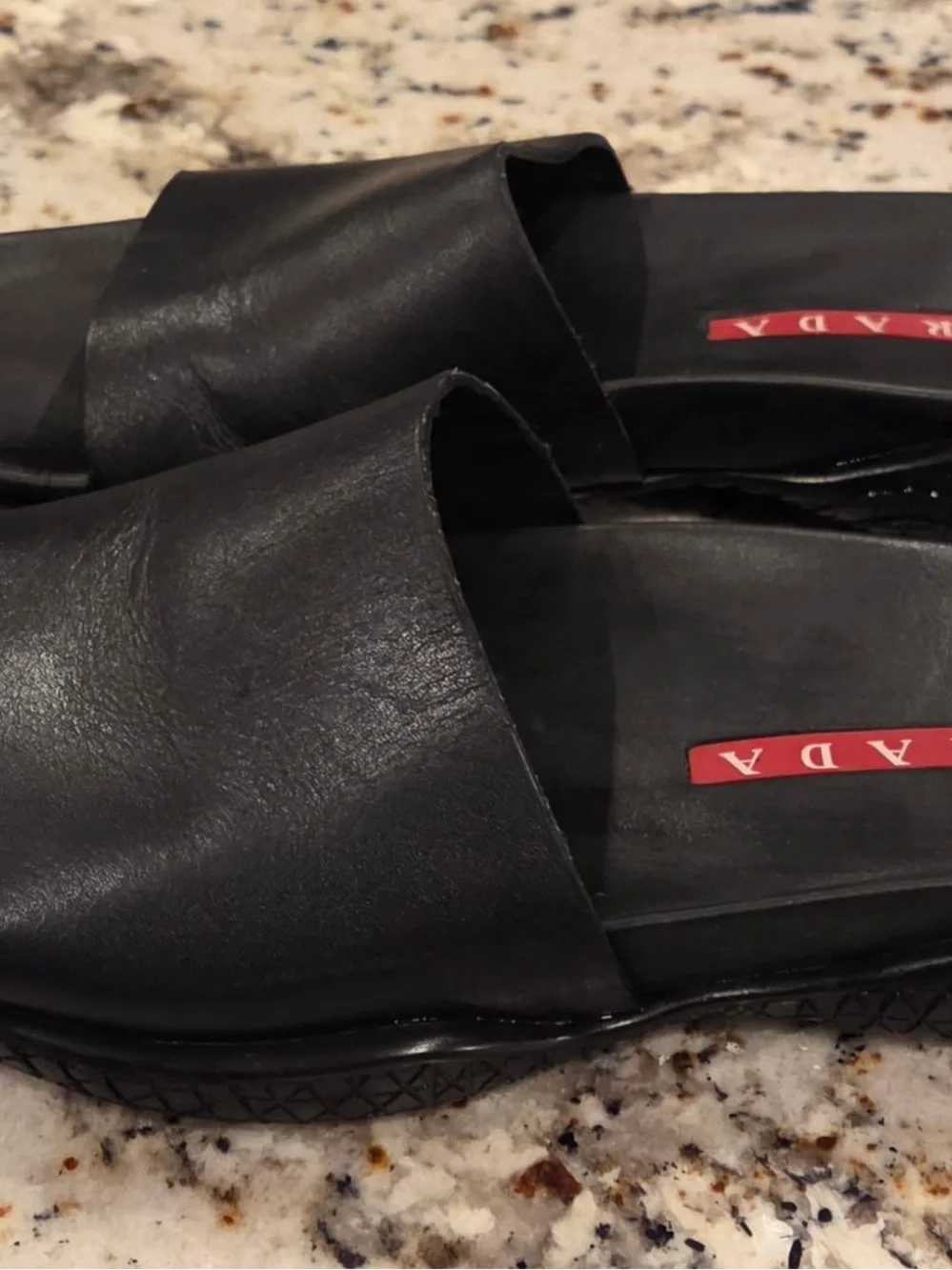 Prada Black Leather Slide Sandals with Red Logo Inlay